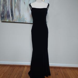 Black velvet open back mermaid evening gown with rhinestone detail
